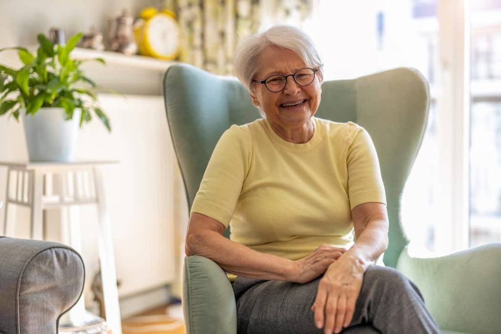Senior lady smiling at home