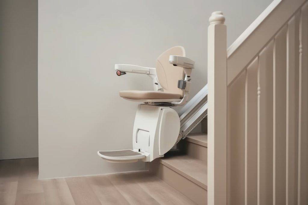 Clean stairlift pared at bottom of stairs